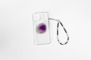 WMC Aries Zodiac phone charm displayed on a clear phone case with Amethyst phone grip