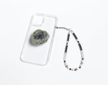 Load image into Gallery viewer, WMC Gemini Zodiac phone charm displayed on a clear phone case with Labradorite phone grip
