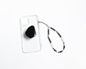 WMC Leo Zodiac phone charm displayed on a clear phone case with Obsidian phone grip
