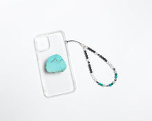 Load image into Gallery viewer, WMC Scorpio Zodiac phone charm displayed on a clear phone case with Turquoise phone grip
