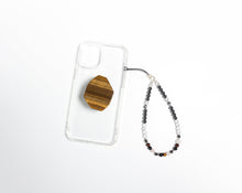 Load image into Gallery viewer, WMC Taurus Zodiac phone charm displayed on a clear phone case with Tigerseye phone grip

